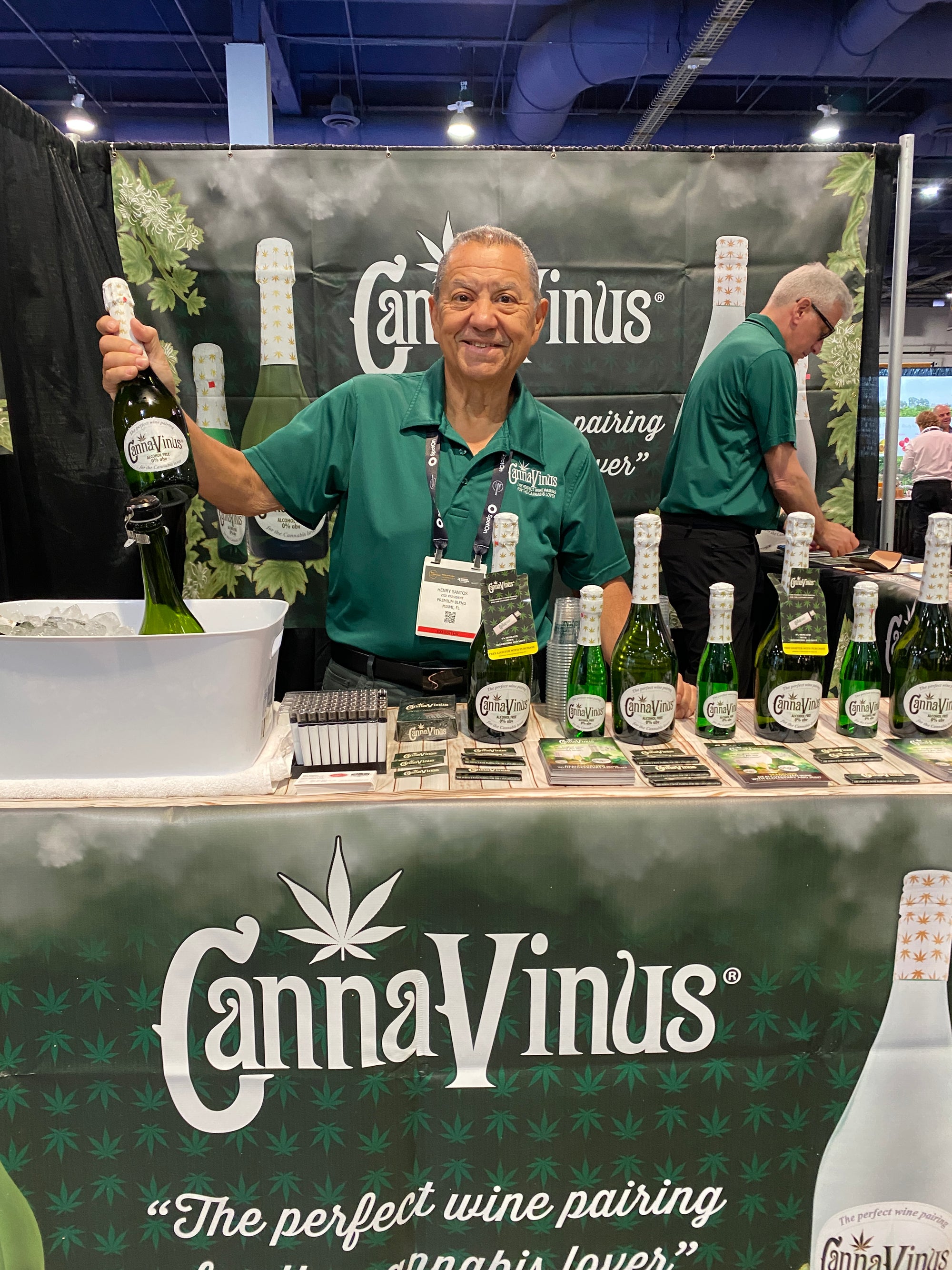 owner of CannaVinus showcasing the products at a convention booth for Canna Vinus products