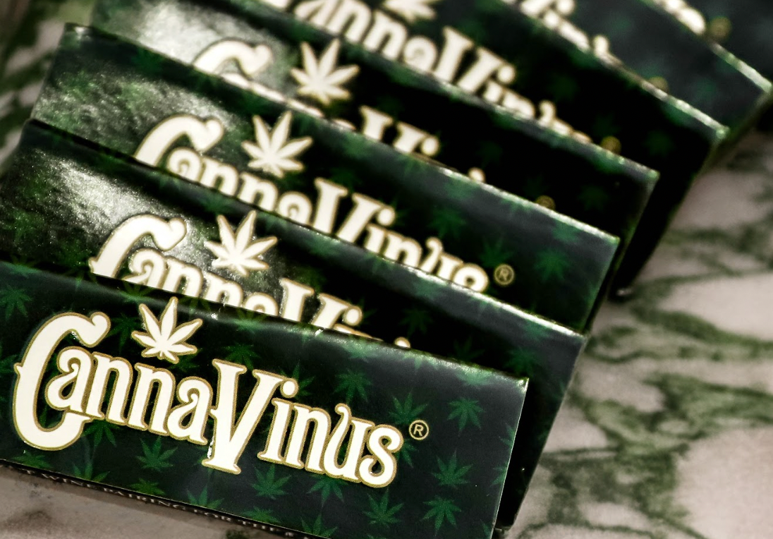 a stack of CannaVinus Rolling papers layered on a table