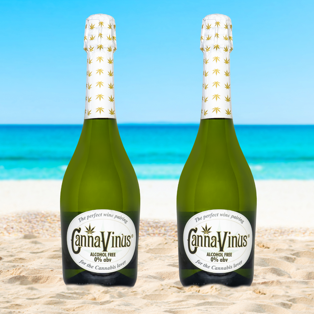 two 750ml bottles of CannaVinus on the beach with water in the background