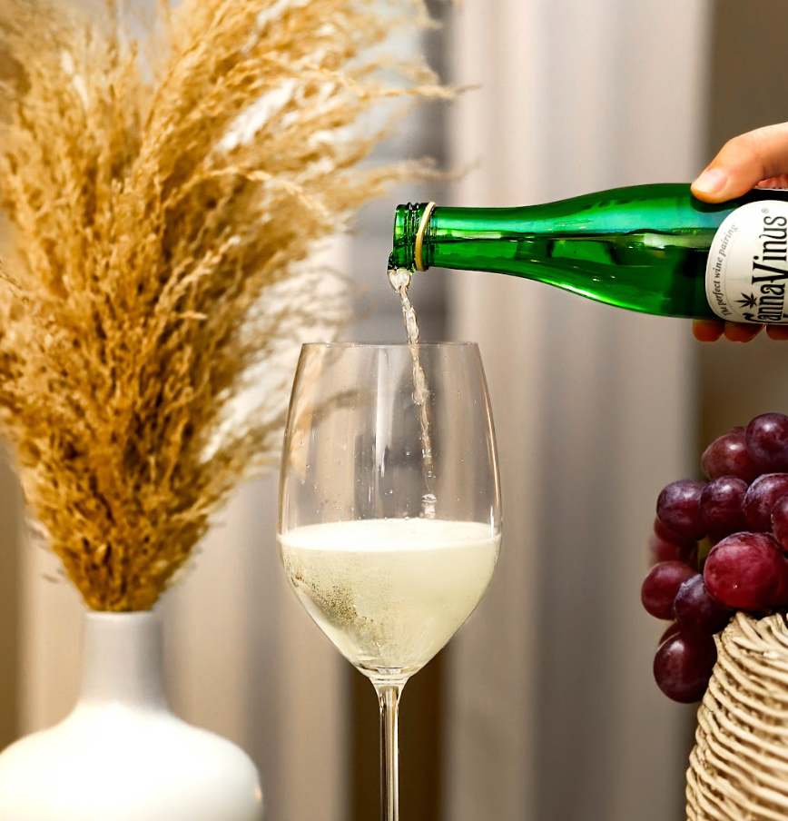 Cannavinus Alcohol Free Wine 750ml Bottle on a table being poured into a glass